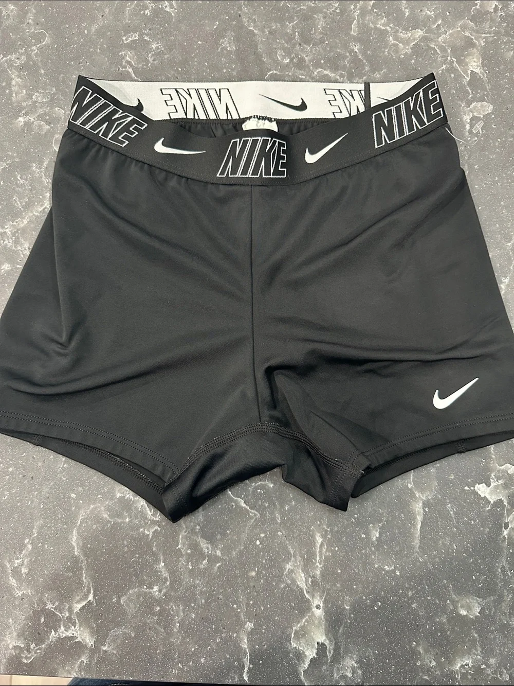 Nike Black Athletic Compression Shorts with White Swoosh and Branded Waistband